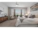 Bright bedroom featuring a large bay window, neutral paint, and comfortable seating at 1752 Peninsula Cir, Castle Rock, CO 80104