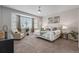 Relaxing bedroom with neutral tones and bay window offering plenty of natural light at 1752 Peninsula Cir, Castle Rock, CO 80104