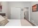 Bedroom featuring a neutral color palette, double closet and an ensuite bathroom at 1752 Peninsula Cir, Castle Rock, CO 80104
