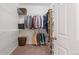 Walk-in closet featuring ample storage with shelving, hanging rods, and a basket for laundry at 1752 Peninsula Cir, Castle Rock, CO 80104