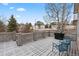 Cozy outdoor deck with lattice railings and two chairs overlooking the backyard at 1752 Peninsula Cir, Castle Rock, CO 80104