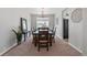 Traditional dining room with chandelier and large window to create the perfect space for gathering at 1752 Peninsula Cir, Castle Rock, CO 80104