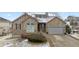 Charming stone-clad home with a two-car garage, complimented by manicured landscaping at 1752 Peninsula Cir, Castle Rock, CO 80104
