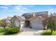 Beautiful stone and siding home featuring solar panels and a well-maintained front yard at 1752 Peninsula Cir, Castle Rock, CO 80104