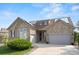 Charming stone-accented home with attached garages and solar panels at 1752 Peninsula Cir, Castle Rock, CO 80104