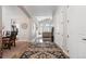 Bright foyer with hardwood floors, an elegant rug, and arched doorways, creating a welcoming atmosphere at 1752 Peninsula Cir, Castle Rock, CO 80104
