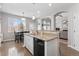 Open concept kitchen with granite countertops, dining area, and natural light at 1752 Peninsula Cir, Castle Rock, CO 80104