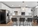 Well-equipped kitchen featuring a large island with bar stools and granite countertops at 1752 Peninsula Cir, Castle Rock, CO 80104