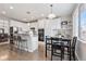 Bright kitchen with granite counters and an island, open to a dining area with a view at 1752 Peninsula Cir, Castle Rock, CO 80104