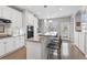 Stylish kitchen featuring granite counters, stainless appliances, and counter seating by the window at 1752 Peninsula Cir, Castle Rock, CO 80104