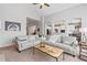 Bright living room boasts an open floor plan and neutral decor, perfect for entertaining at 1752 Peninsula Cir, Castle Rock, CO 80104