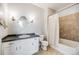 Updated bathroom with vanity sink, framed mirror and a bathtub with shower at 2672 S Cathay Way # 304, Aurora, CO 80013