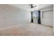 Bright carpeted bedroom with natural light, window and closet at 2672 S Cathay Way # 304, Aurora, CO 80013