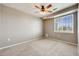 Clean bedroom with bright window and ceiling fan at 2672 S Cathay Way # 304, Aurora, CO 80013