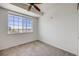 Cozy bedroom with large window offering plenty of natural light and ceiling fan at 2672 S Cathay Way # 304, Aurora, CO 80013