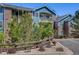 Attractive two-story building with brick and blue siding, nicely landscaped at 2672 S Cathay Way # 304, Aurora, CO 80013