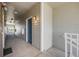 Hallway with neutral siding and a blue door at 2672 S Cathay Way # 304, Aurora, CO 80013