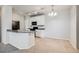 The kitchen with white cabinets, modern appliances, and an adjoining dining area at 2672 S Cathay Way # 304, Aurora, CO 80013