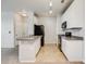The kitchen features white cabinets, modern appliances, and tile floors at 2672 S Cathay Way # 304, Aurora, CO 80013