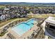 Aerial view of a community pool, showcasing ample seating, shade, and a relaxing atmosphere at 4855 Saddle Iron Rd, Castle Rock, CO 80104