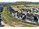 Stunning aerial view of a residential community, showcasing manicured lawns and beautiful home exteriors at 4855 Saddle Iron Rd, Castle Rock, CO 80104