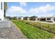 Spacious backyard with a well-maintained lawn, a wooden fence, and beautiful landscaping, great for outdoor living at 4855 Saddle Iron Rd, Castle Rock, CO 80104