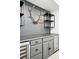 Custom basement bar with cabinets, countertop, and wine/beverage refrigerator at 4855 Saddle Iron Rd, Castle Rock, CO 80104