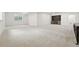 Finished basement area featuring neutral carpet and a built-in bar area at 4855 Saddle Iron Rd, Castle Rock, CO 80104