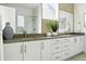 Modern bathroom featuring double vanity, sleek fixtures, and a luxurious design at 4855 Saddle Iron Rd, Castle Rock, CO 80104