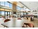 Spacious clubhouse interior with modern design, a fireplace, and large windows offering scenic views at 4855 Saddle Iron Rd, Castle Rock, CO 80104