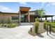 Inviting community clubhouse entrance, surrounded by lush landscaping and a welcoming walkway at 4855 Saddle Iron Rd, Castle Rock, CO 80104