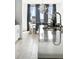 Bright kitchen with stainless steel countertops, modern faucet, and dining area at 4855 Saddle Iron Rd, Castle Rock, CO 80104