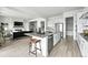 Open concept kitchen features stainless steel appliances, an island, and an open floor plan at 4855 Saddle Iron Rd, Castle Rock, CO 80104