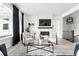 Cozy living room with fireplace, modern decor, and ample natural light at 4855 Saddle Iron Rd, Castle Rock, CO 80104