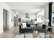 Open living space with modern kitchen, stainless appliances, and comfortable seating at 4855 Saddle Iron Rd, Castle Rock, CO 80104