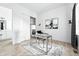 Bright home office with stylish desk, ample space, and a closet at 4855 Saddle Iron Rd, Castle Rock, CO 80104