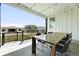 Covered outdoor patio featuring a large table with seating, providing an ideal space for relaxing and enjoying the outdoors at 4855 Saddle Iron Rd, Castle Rock, CO 80104