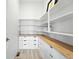 Walk-in pantry features custom shelving, drawers, and ample storage space at 4855 Saddle Iron Rd, Castle Rock, CO 80104