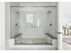 Contemporary glass shower with dual shower heads and built-in seating at 4855 Saddle Iron Rd, Castle Rock, CO 80104