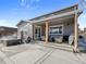 Backyard with a covered patio, outdoor furniture, a hot tub, and BBQ at 2924 Echo Park Dr, Castle Rock, CO 80104