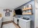 Stylish basement bar with seating, under-counter fridge, and shelves for displaying drinks at 2924 Echo Park Dr, Castle Rock, CO 80104
