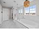 Bright bathroom with dual sinks, stylish fixtures, and a shower with seamless glass doors, showcasing a modern design at 2924 Echo Park Dr, Castle Rock, CO 80104