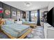 Bright bedroom with 2 twin beds, stylish decor, and a window that offers pleasant views at 2924 Echo Park Dr, Castle Rock, CO 80104