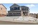 Inviting two-story house with a large driveway, a covered porch, and a manicured front yard at 2924 Echo Park Dr, Castle Rock, CO 80104