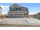 Charming two-story home featuring a two car garage and well-maintained landscaping and grey and white trim at 2924 Echo Park Dr, Castle Rock, CO 80104