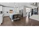 Open-concept kitchen with a large island, white cabinets, and hardwood floors, perfect for entertaining at 2924 Echo Park Dr, Castle Rock, CO 80104