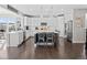 Modern kitchen with white cabinetry, stainless steel appliances, a large island, and stylish pendant lights at 2924 Echo Park Dr, Castle Rock, CO 80104