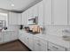 Bright kitchen features white cabinets, subway tile backsplash, quartz countertops, and stainless steel appliances at 2924 Echo Park Dr, Castle Rock, CO 80104