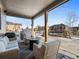 Covered patio with seating, a fire pit, and a view of the backyard at 2924 Echo Park Dr, Castle Rock, CO 80104