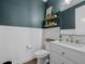 Stylish powder room with wainscoting, modern vanity, and elegant fixtures at 2924 Echo Park Dr, Castle Rock, CO 80104